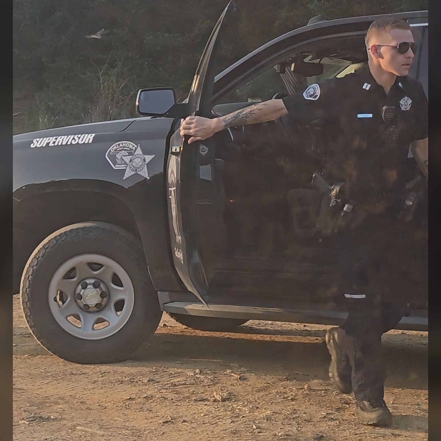 Oklahoma Safety Agency officer stepping out of a marked supervisor patrol truck